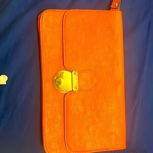 Orange leather clutch with wristlet